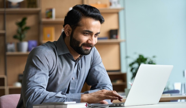 Man at computer preparing to build a WordPress website