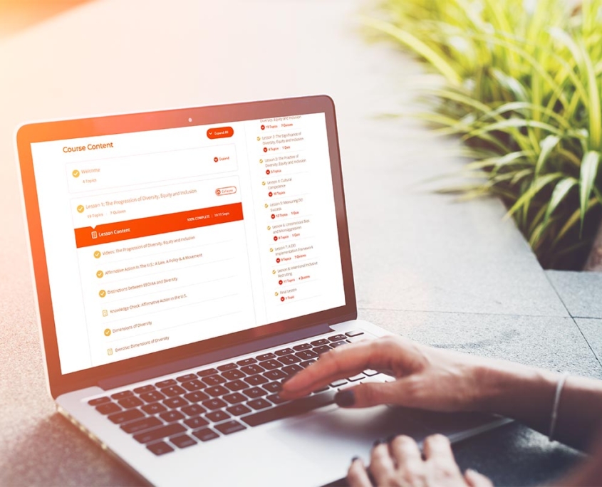 Person navigating LearnDash course content on laptop